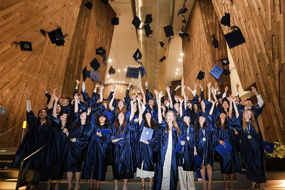 Class of 2026 tossing their cap during the graduation ceremony