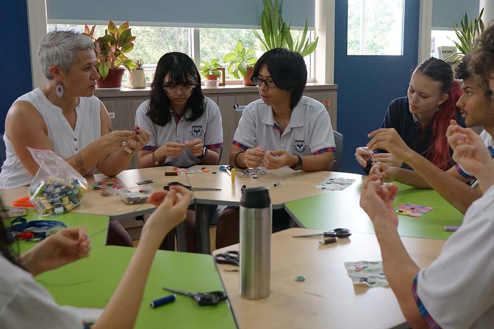 Diploma students attending a life-skills lesson with a teacher